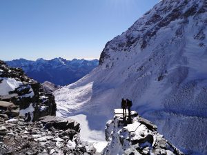 A photo of myself and a friend on Mt Earnslaw on a rock ledge